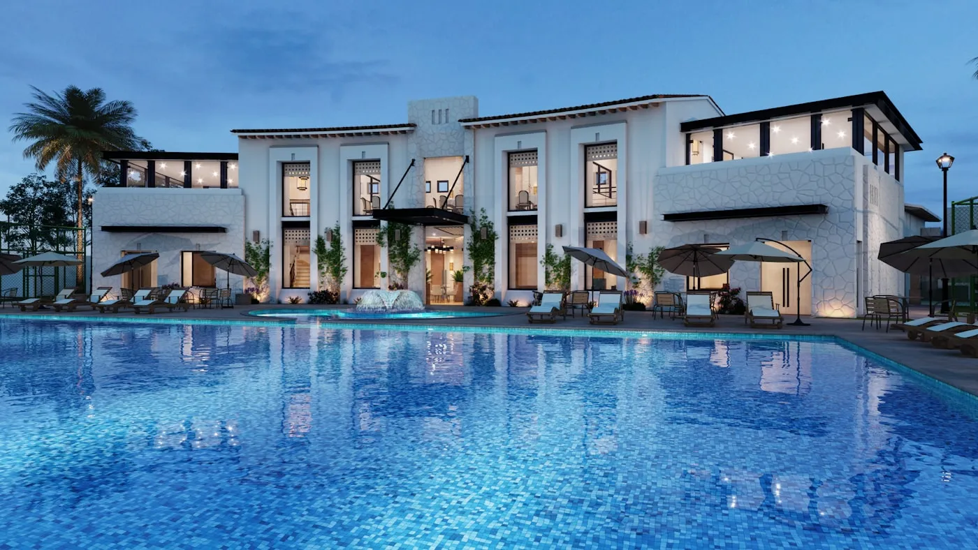 A boutique multi-room hotel lit up at dusk
